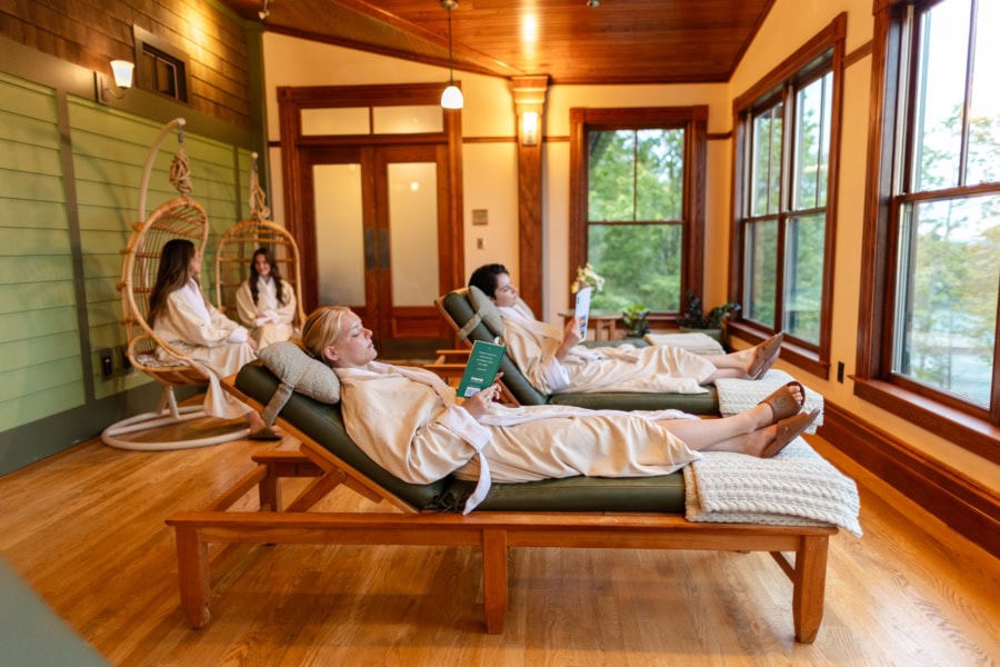 Person walking along a curved path in green hills